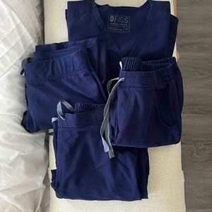 Navy figs scrubs, 3 pairs of pants and one top. Package all together